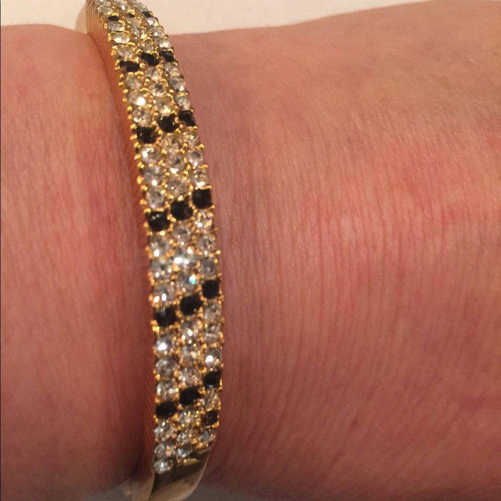 Gold rhinestone triple row bracelet with black + cz stones inset